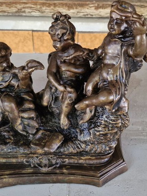 Bronze sculpture of three children putti, used