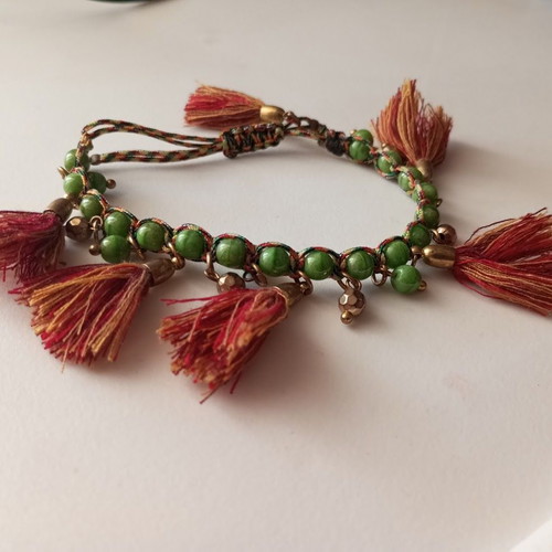Bracelet new with green beads and red tassels boho style