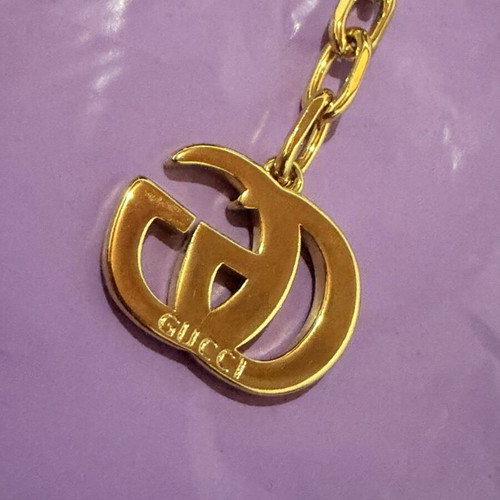 Gucci gold necklace with large GG pendant and chain, new