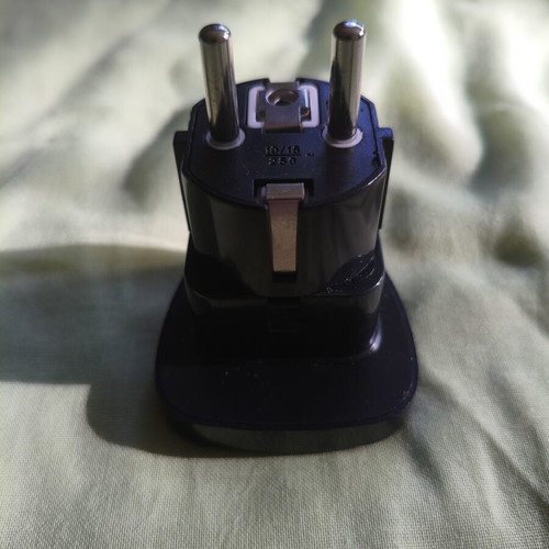 Universal travel adapter with safety cover, black