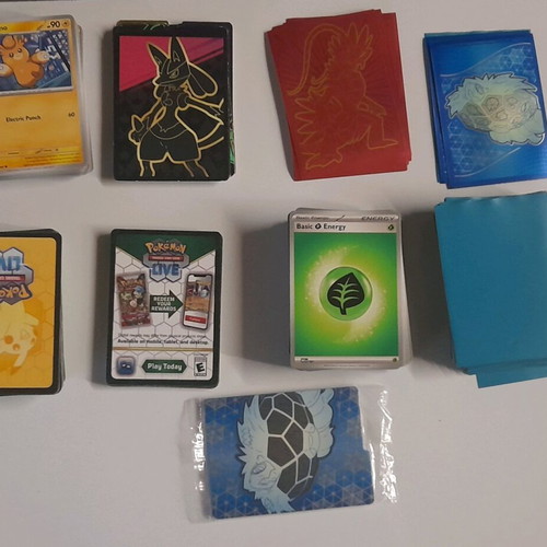 Pokémon lot used with 53 cards, 65 energy cards and 62 sleeves
