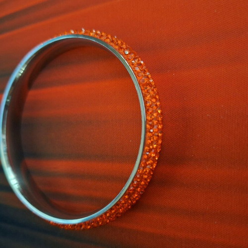 Bracelet new in orange color full of rhinestones