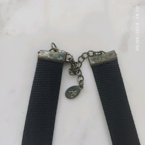 Accessorize necklace used with black thick ribbon and large beads