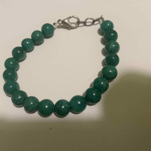Bracelet with green beads and safety clasp like new