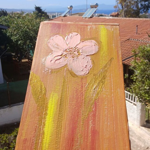 Handmade beeswax candles in decorative box with herbs and oils