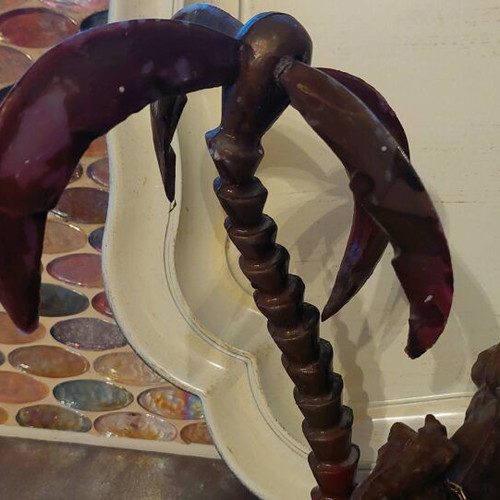 Decorative item used with camels and palm tree made of wood and plastic