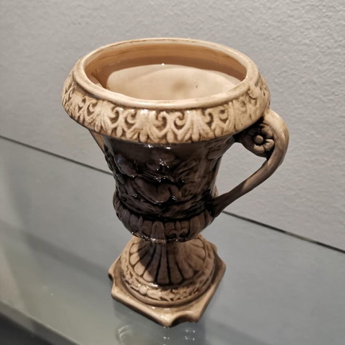 Faience amphora used with embossed design and cupids