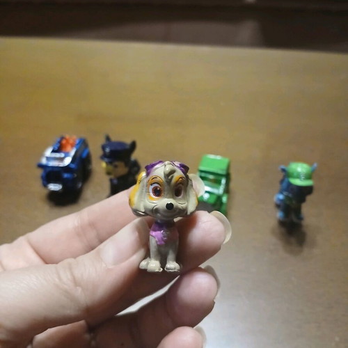 7 Mini Paw Patrol Figures Like New with Vehicles