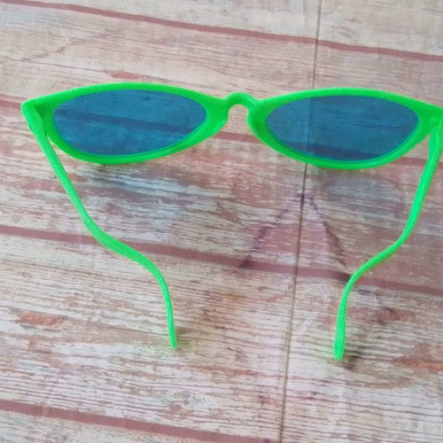 Plastic carnival giant green glasses used