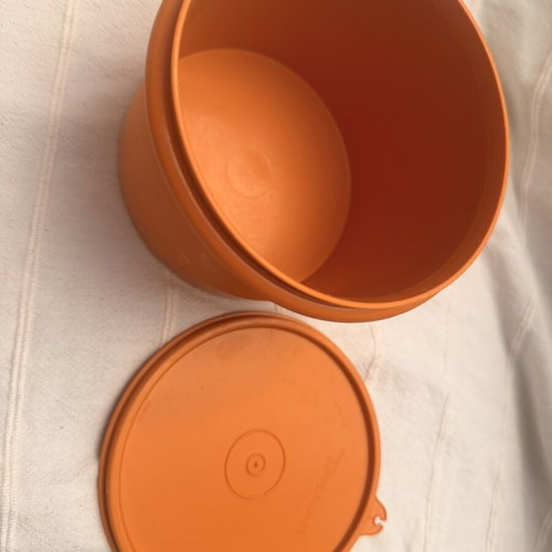 Tupperwear vintage deep circle orange container with lid used