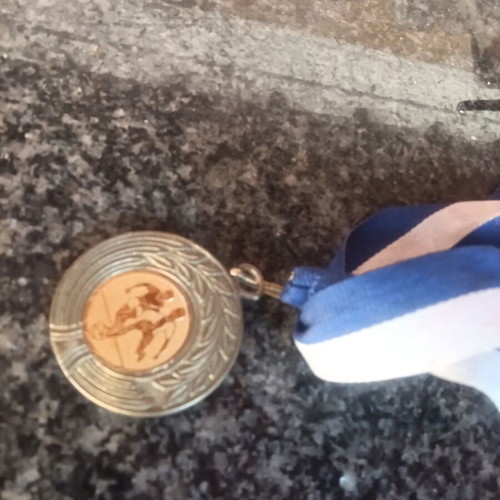 Football collectible medal with gold details