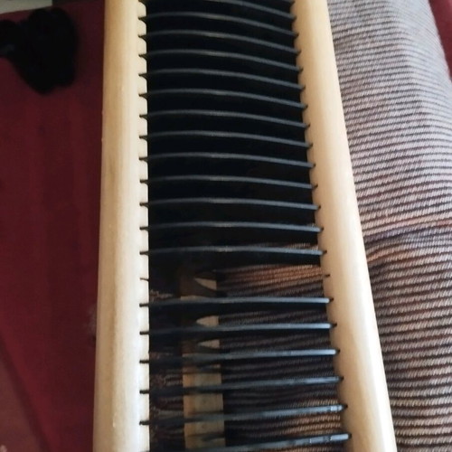 CD rack beige wood with black holders, 30 slots, like new