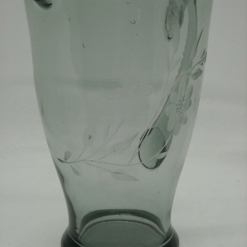 Vintage water pitcher made of blown glass used, gray with floral engravings