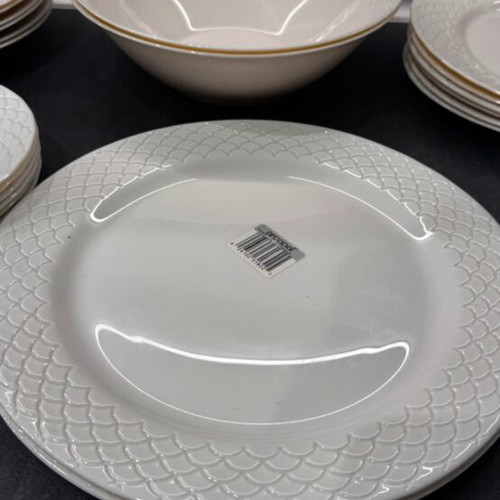 Porcelain dinnerware set with embossed design, like new