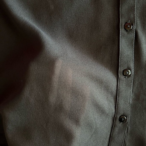 Black sleeveless shirt like new with buttons and pocket