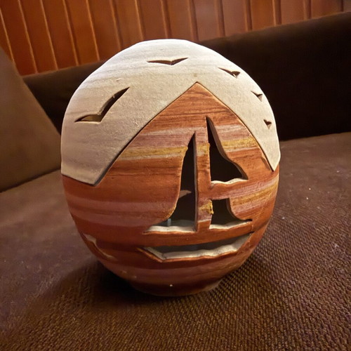 Handmade ceramic lantern with sailboat design, tealight holder
