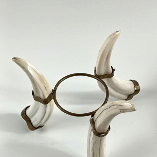 Tripod base used from fakocheros teeth with ostrich egg
