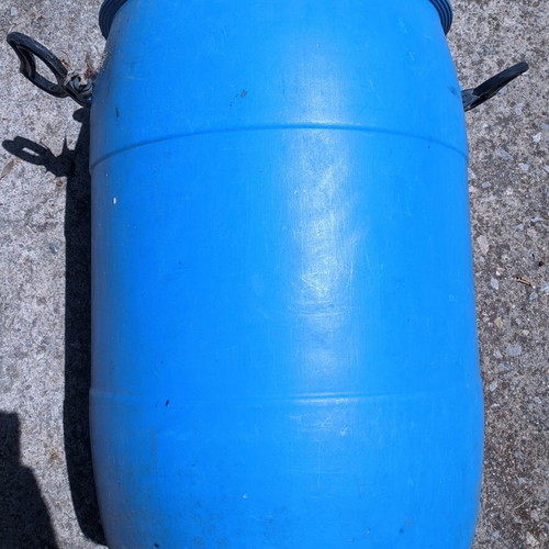 Plastic barrel like new with lid and handles