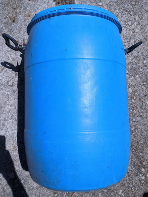 Plastic barrel like new with lid and handles