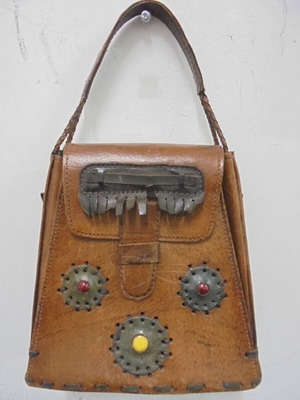 Vintage leather handbag with decorative ornaments, used, brown