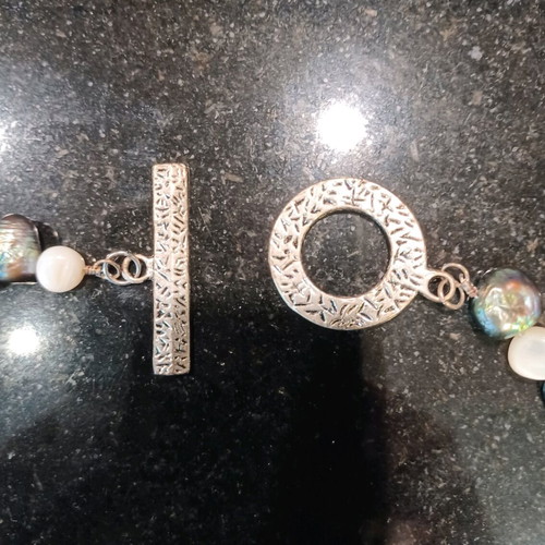 Necklace with white and olive stones, carved clasp, like new