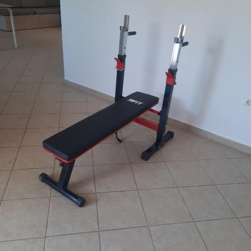X-FIT gym bench like new with barbell stands