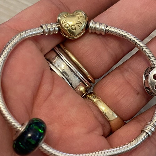 Pandora bracelet 925 silver with gold-plated clasp and two charms, used, 17 cm