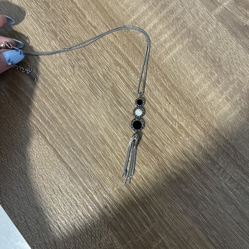 Long necklace with geometric design and tassel, black and silver