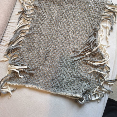Knitted scarf used with boho style in gray and cream