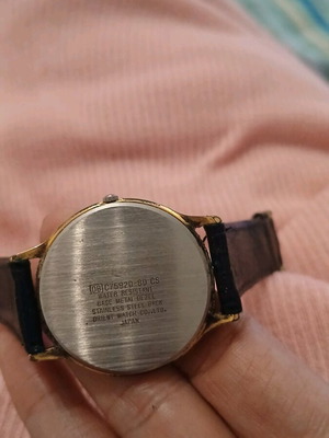 Orient vintage wristwatch used with gold-plated case and black leather strap