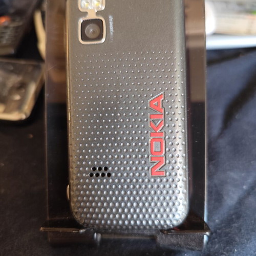 Nokia 5610 XpressMusic phone used with charger