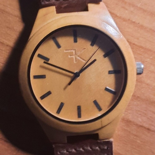 Two vintage wind-up watches and one bamboo watch used