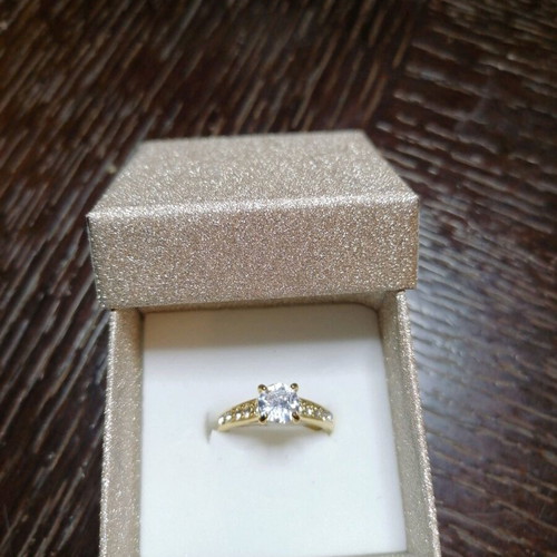 Steel solitaire ring new, gold color