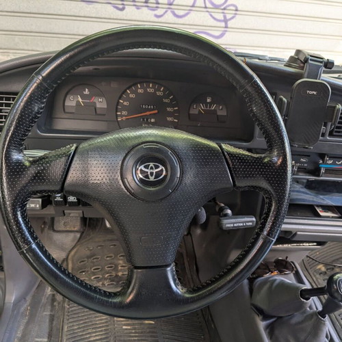 Toyota three-spoke leather steering wheel with airbag horn