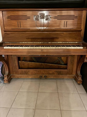 Wooden piano used, antique with key wear