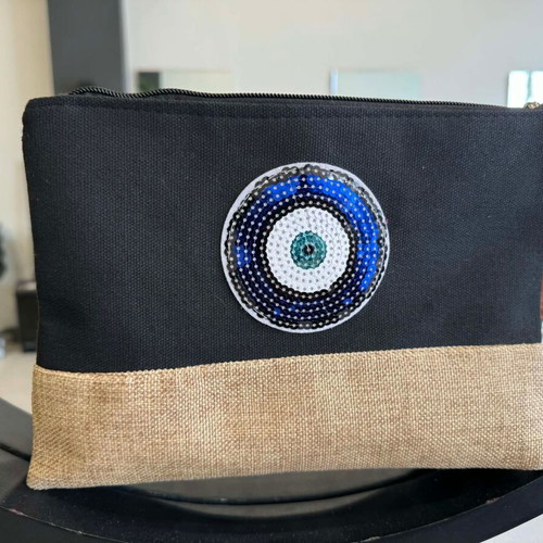 Black clutch bag with blue eye and leather strap new