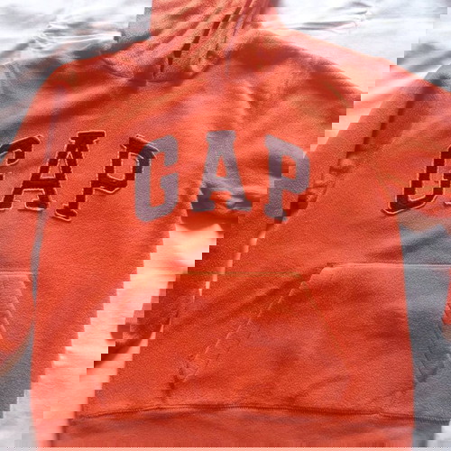 GAP kids hoodie used for ages 8-9, orange color