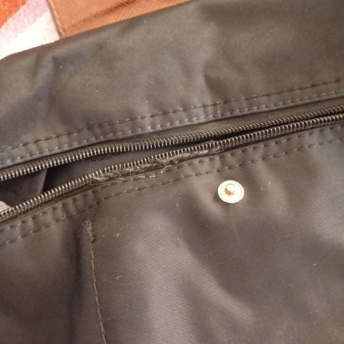 Black backpack with brown flap