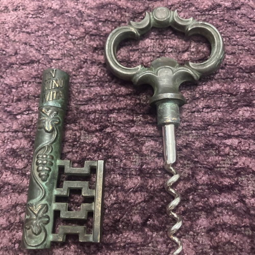Vintage bottle opener used with patina, brass and steel