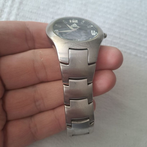 Adidas watch used with black and silver bracelet
