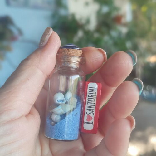 Souvenir from Santorini glass bottle with shells, sand and evil eye magnet like new