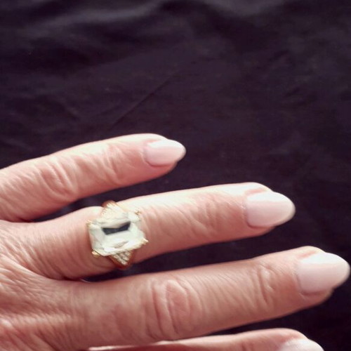 Ring made of gold steel with transparent white stone like new