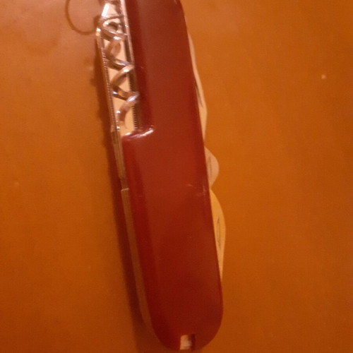 Two multitool pocket knives new with scissors and serrated blade