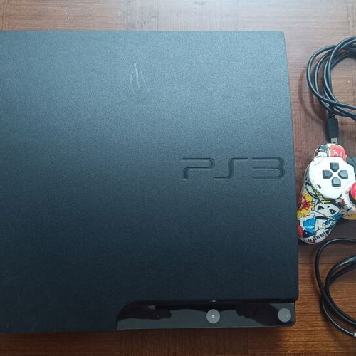 PS3 Slim CECH-2004B console like new with DualShock 3 and 14 games