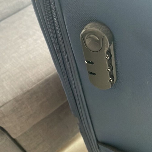 Large suitcase like new, blue, with 360-degree wheels and lock system