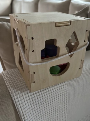 Wooden baby toy with 12 geometric shapes like new
