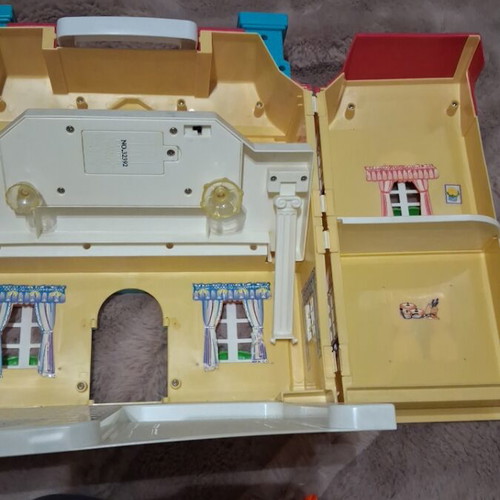 Vintage toy house with light used in good condition