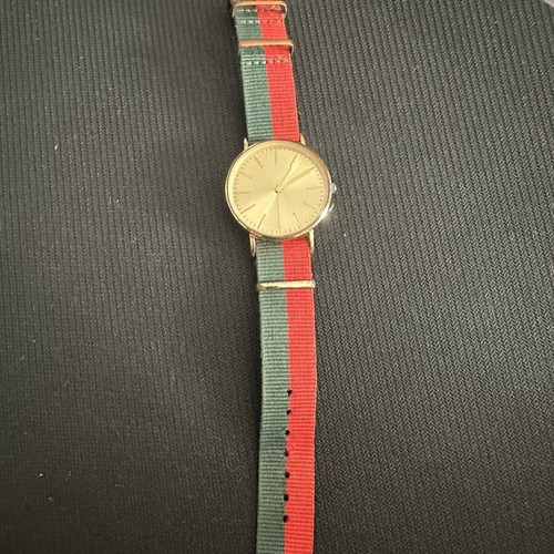 Fashion watch with gold case and NATO fabric strap