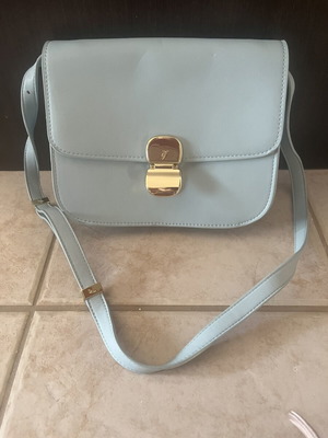 Axel small shoulder bag, blue with unique clasp