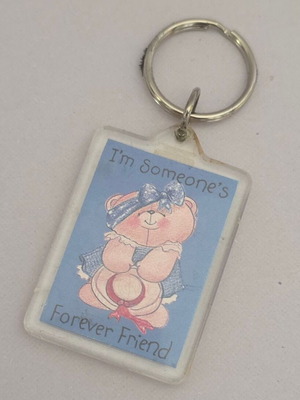Forever Friends keychain with pink teddy bear and blue outfit